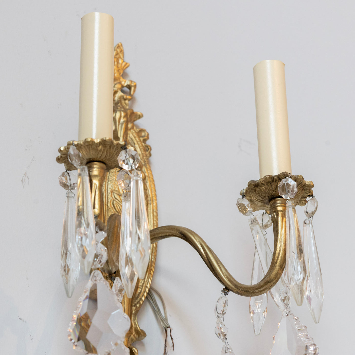 Pair of Louis XVI Gilded Brass Sconces – Carved Oval Backplate & Crystal Drops