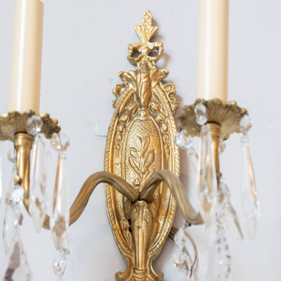 Pair of Louis XVI Gilded Brass Sconces – Carved Oval Backplate & Crystal Drops