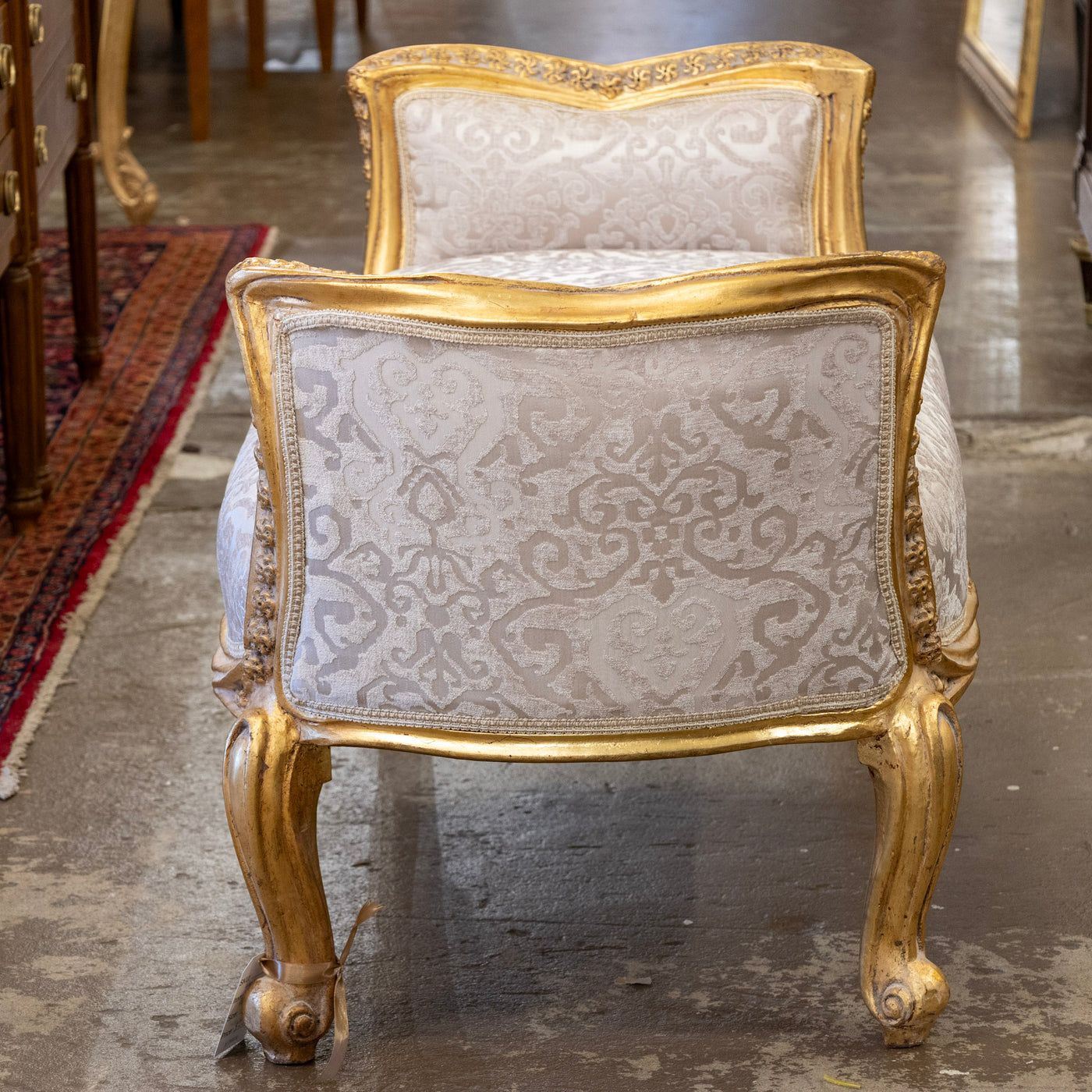 Louis XV Gilded Curule Bench – Floral Carvings & Beige Damask Upholstery