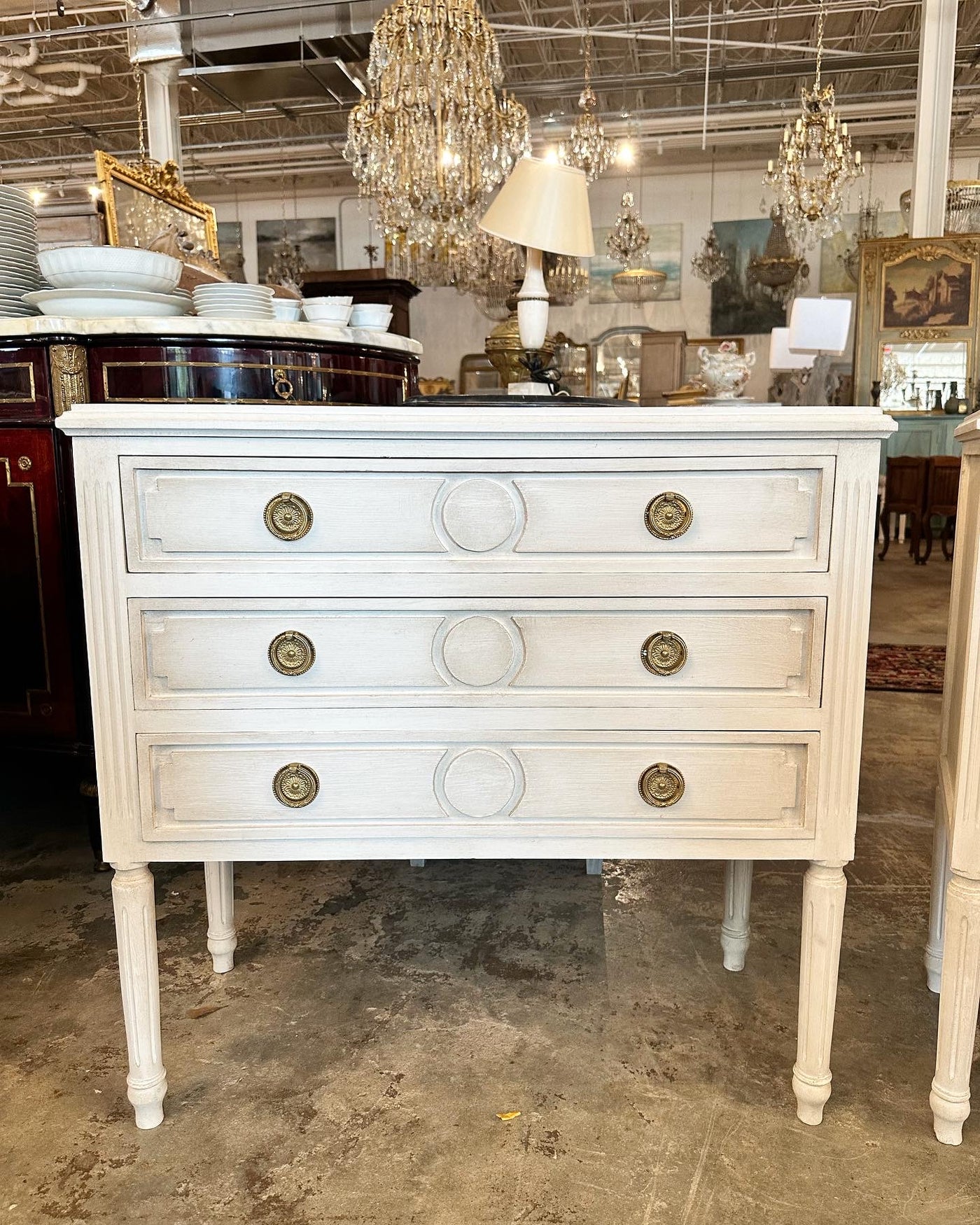 Antique Swedish Chest with Long Legs and Circle Carving | Le Chateau | European Luxury Furniture in Atlanta