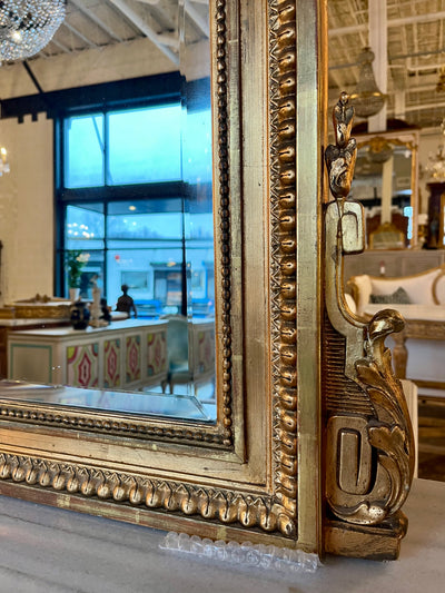 Ornate Mirror with a Gilded Crest and Beaded Details